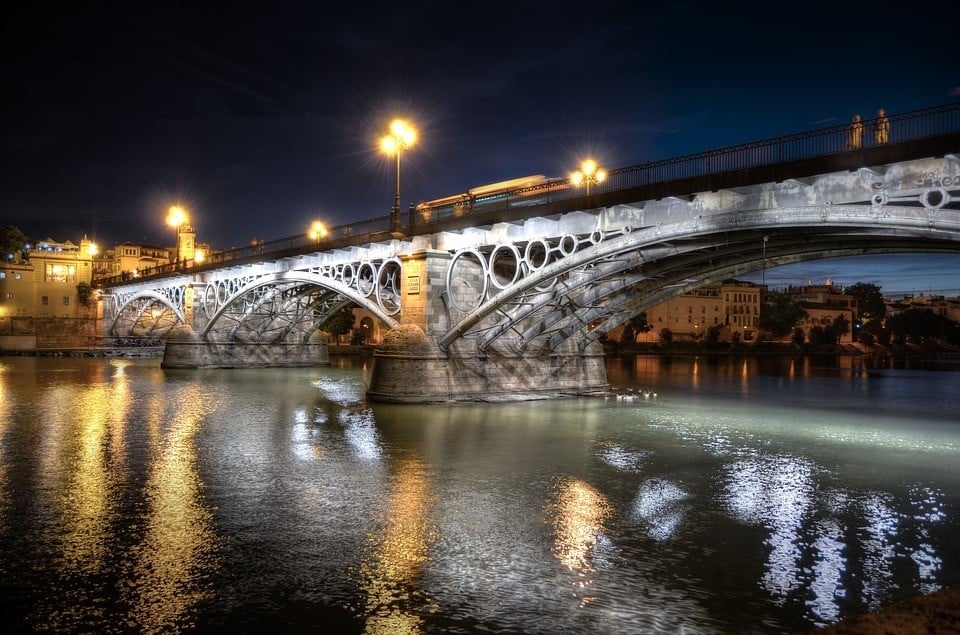 The bridge to Triana, Seville lit up at night