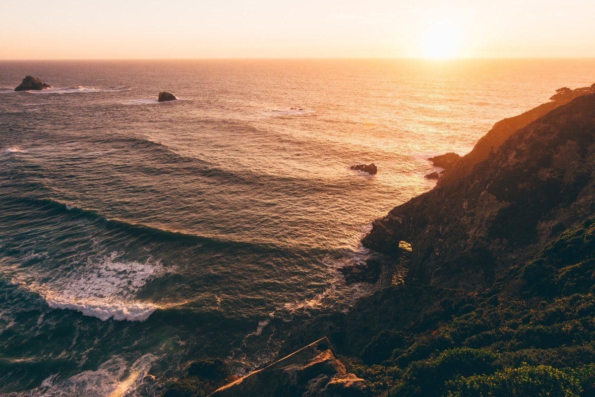 big sur camping on a sunset coastline