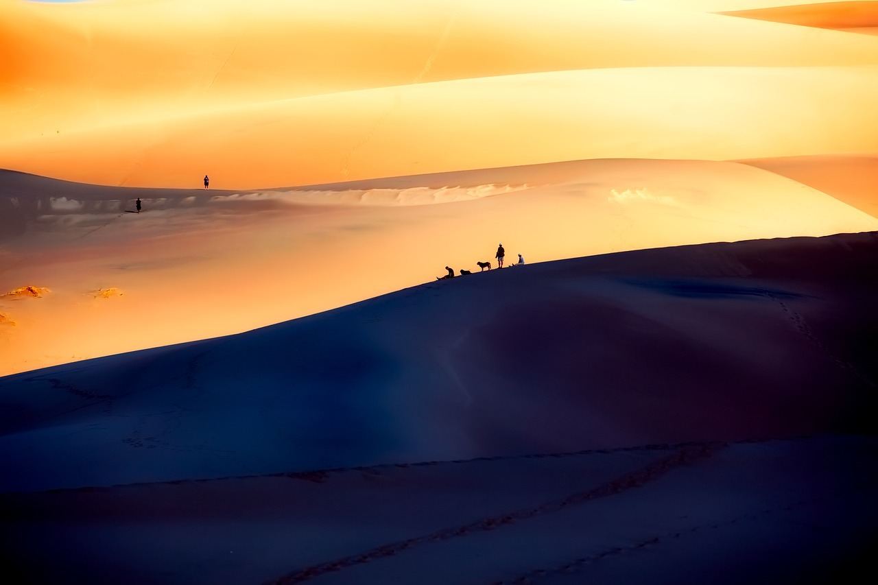 people relaxing on the great sand dunes colorado