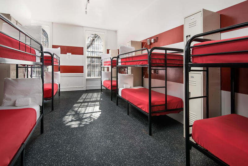 Five red and black bunkbeds in Chicago Getaway Hostel