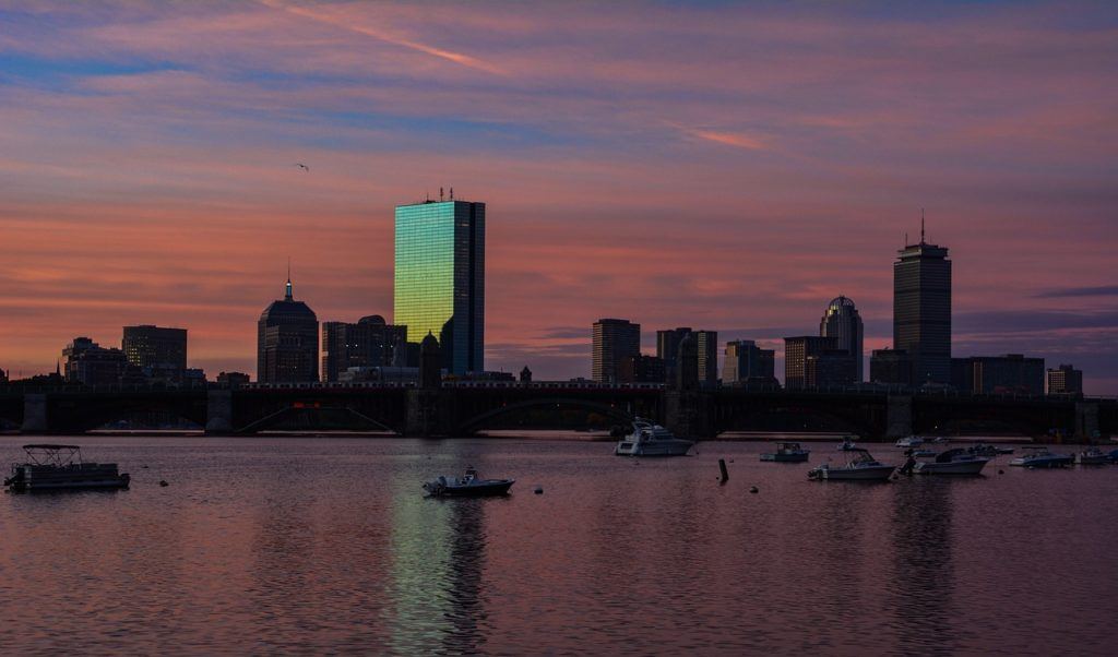 boston harbor sunset with boats on water