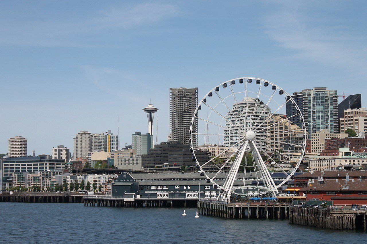 view over the water and toward the city and ferris wheel in queen anne seattle