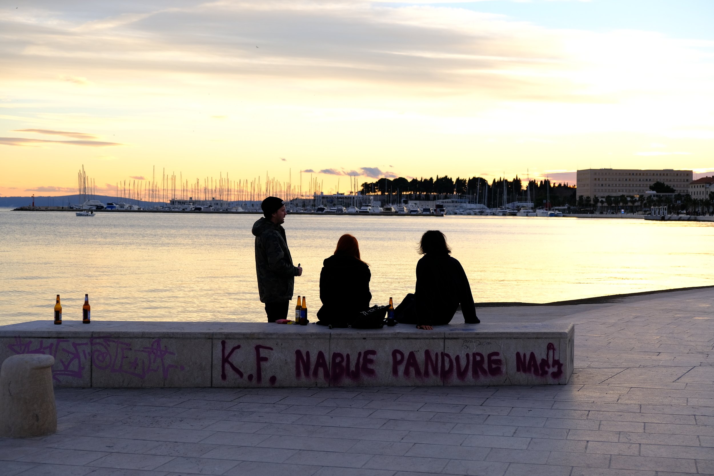 chris and friends having beers by the sea in bacvice, split, croatia