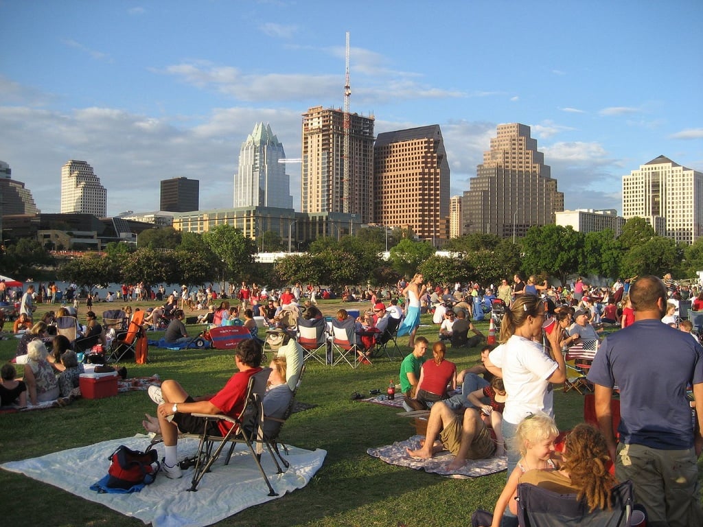 people relaxing in park austin travel guide