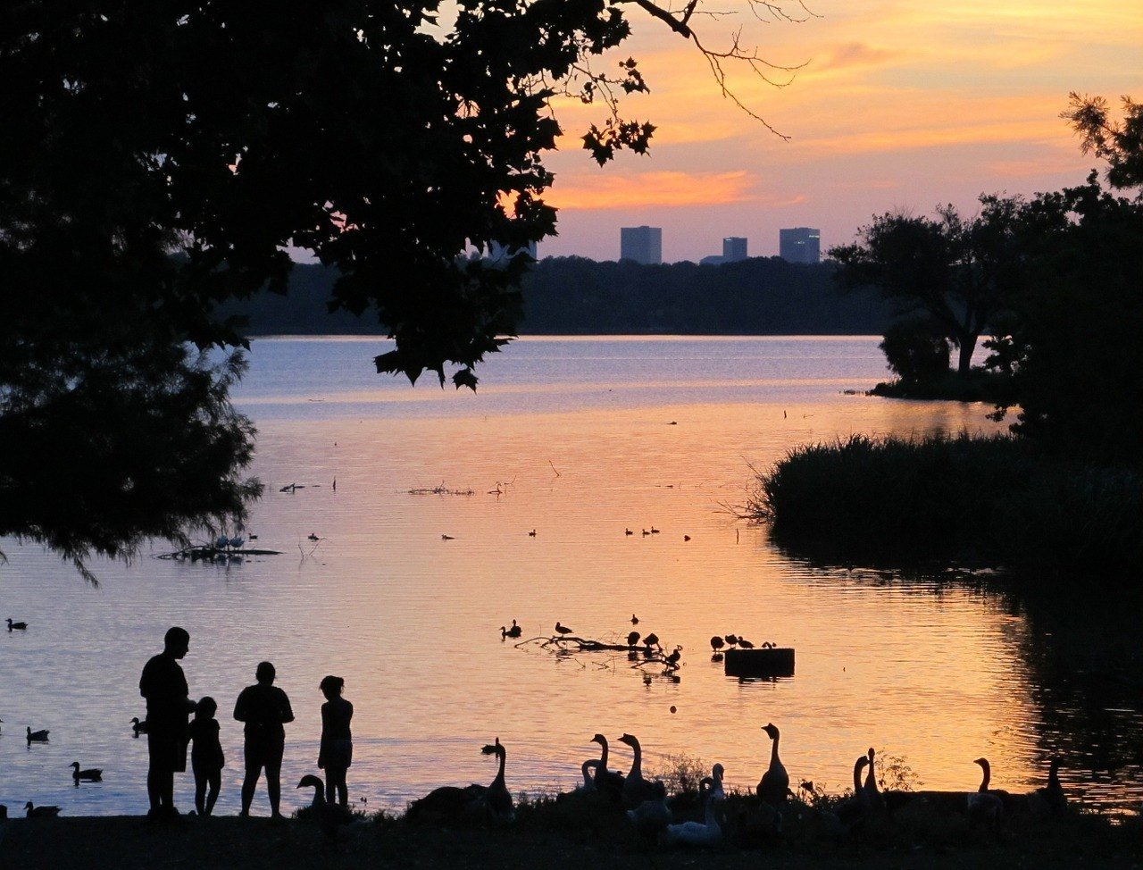 sunset on a lake near dallas travel guide