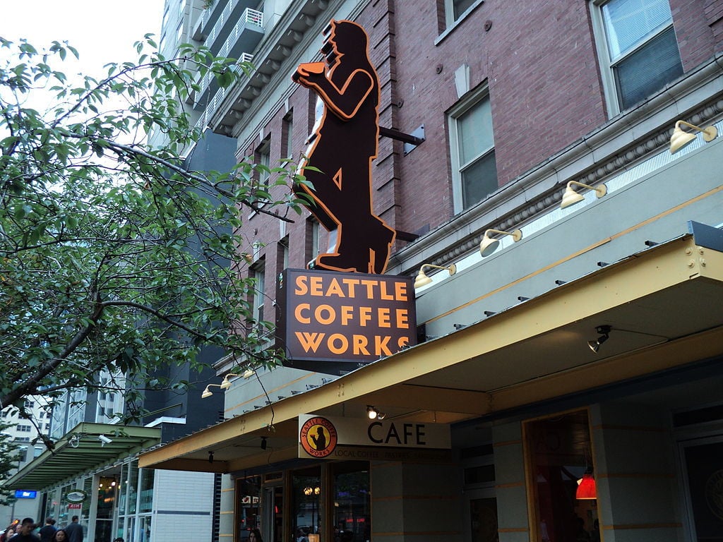 seattle coffee works sign on a street