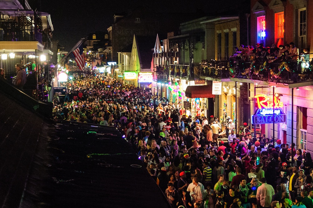 crowds on bourbon street new orleans travel guide