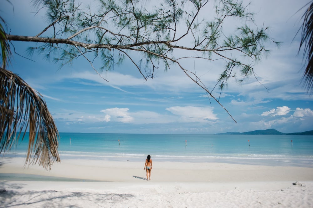 A solo female traveller on a beautiful beach in Cambodia