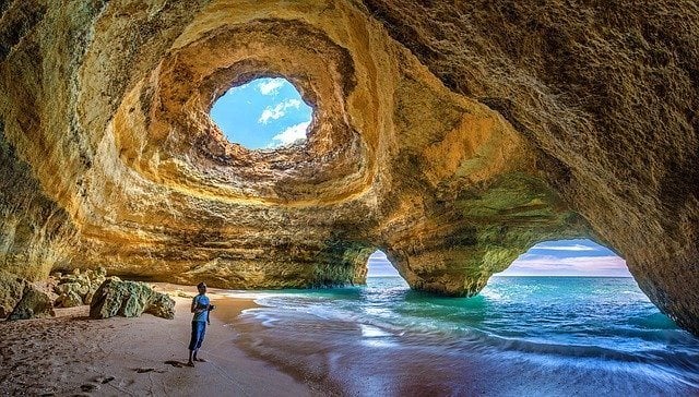 Man travelling in Portugal on the beach