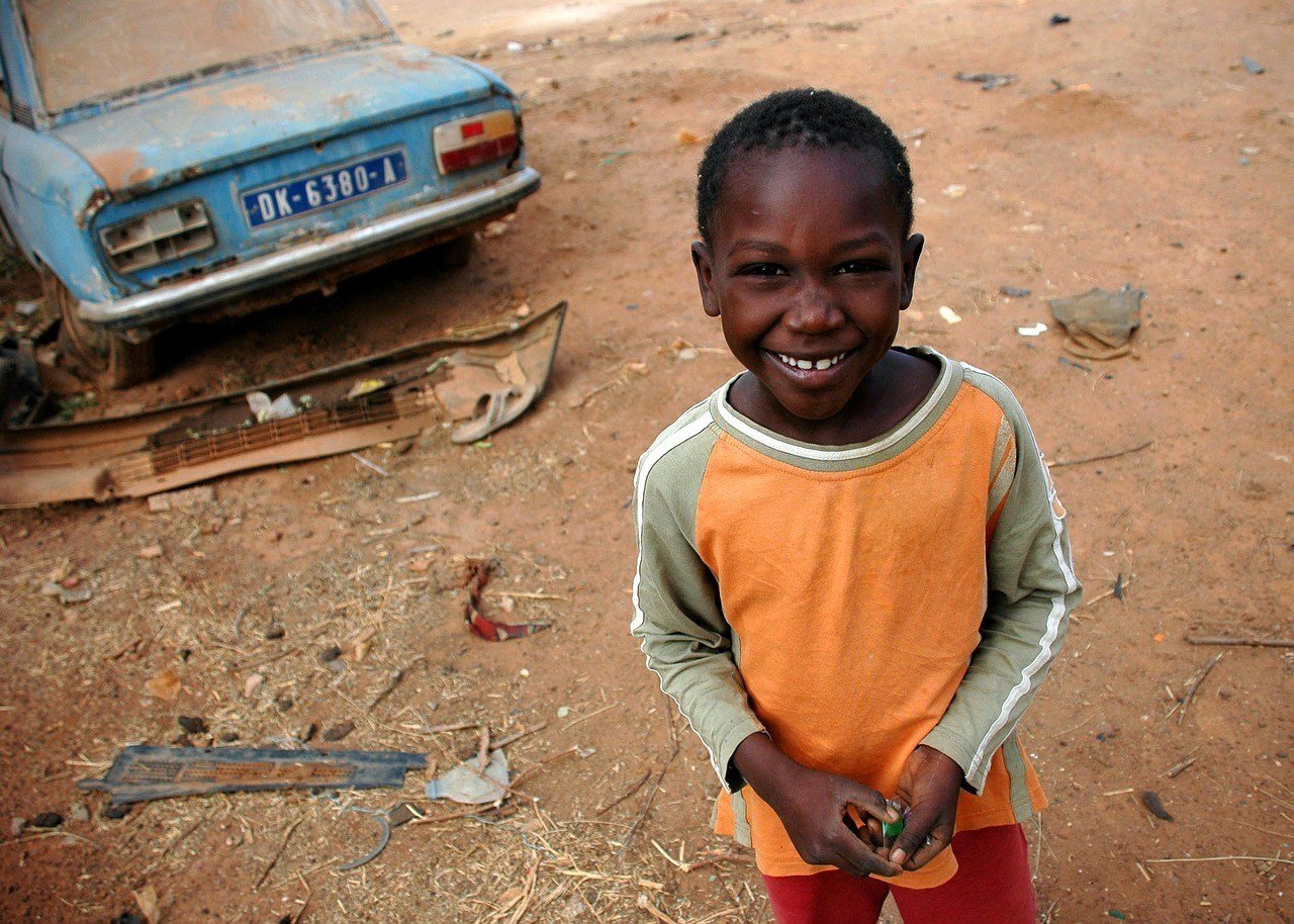 A smiling boy in a cheap travel destination