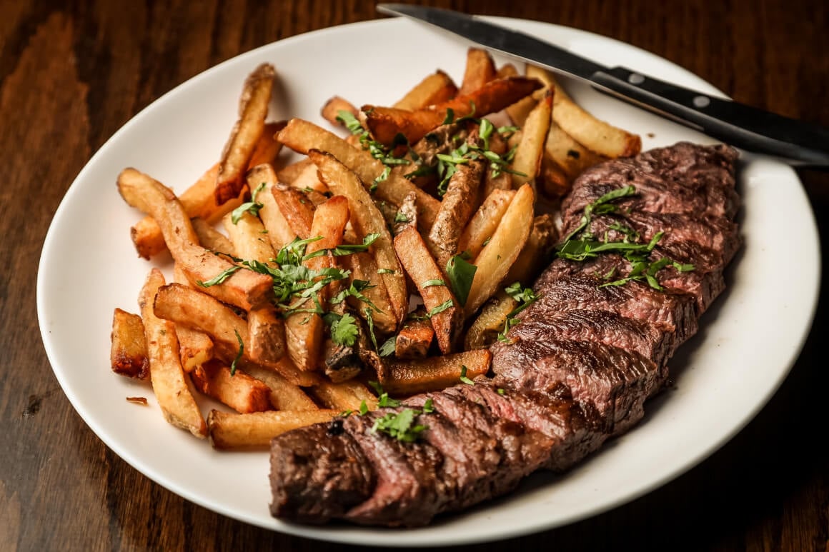 Delightful steak on a plate with fries 