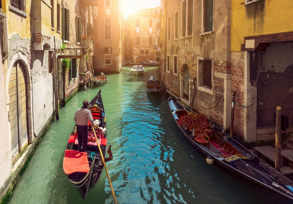 Ride a Gondola Through a Canal Venice