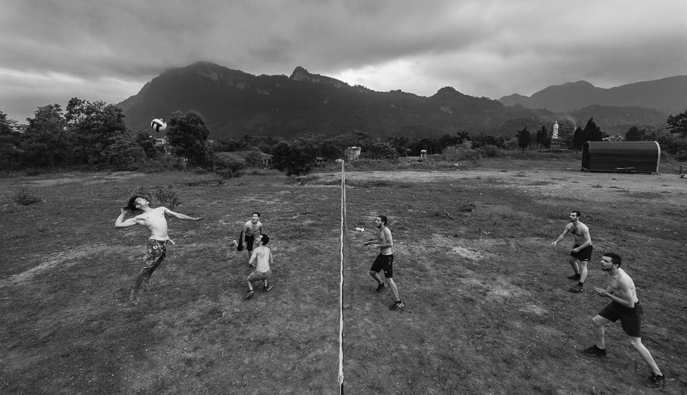 playing volleyball with local Vietnamese people