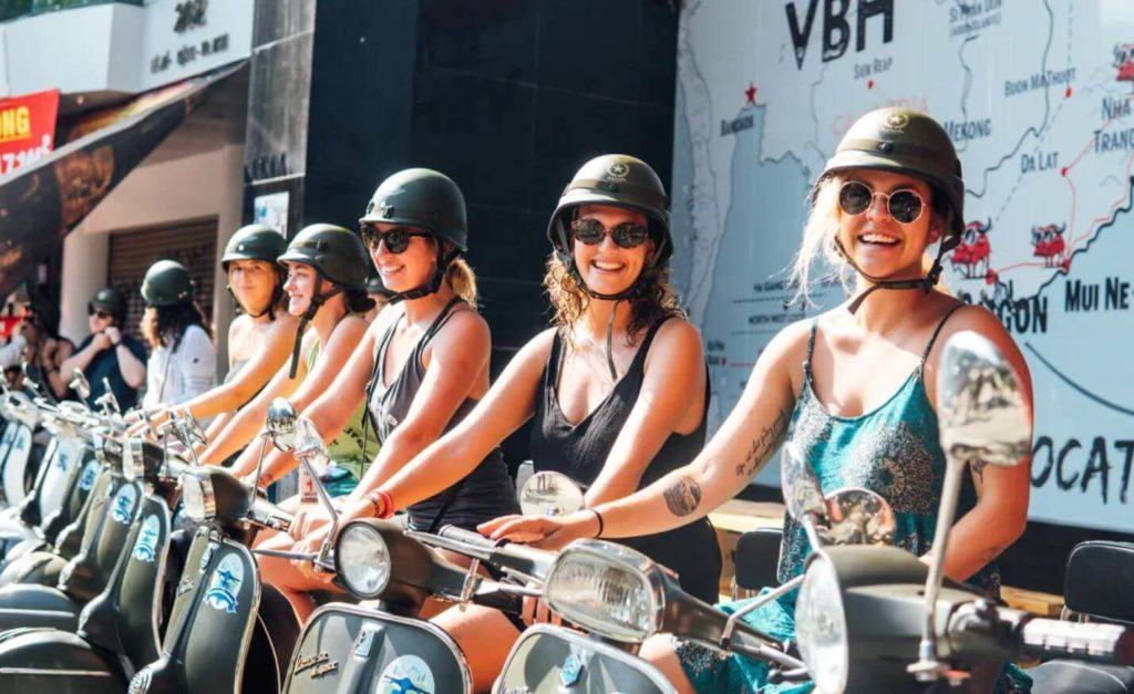 a group renting motorbikes from backpacker hostels