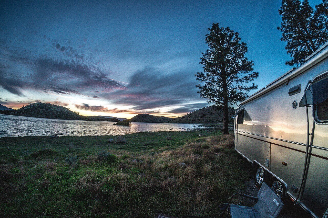 RV camping overnight by a stunning lake