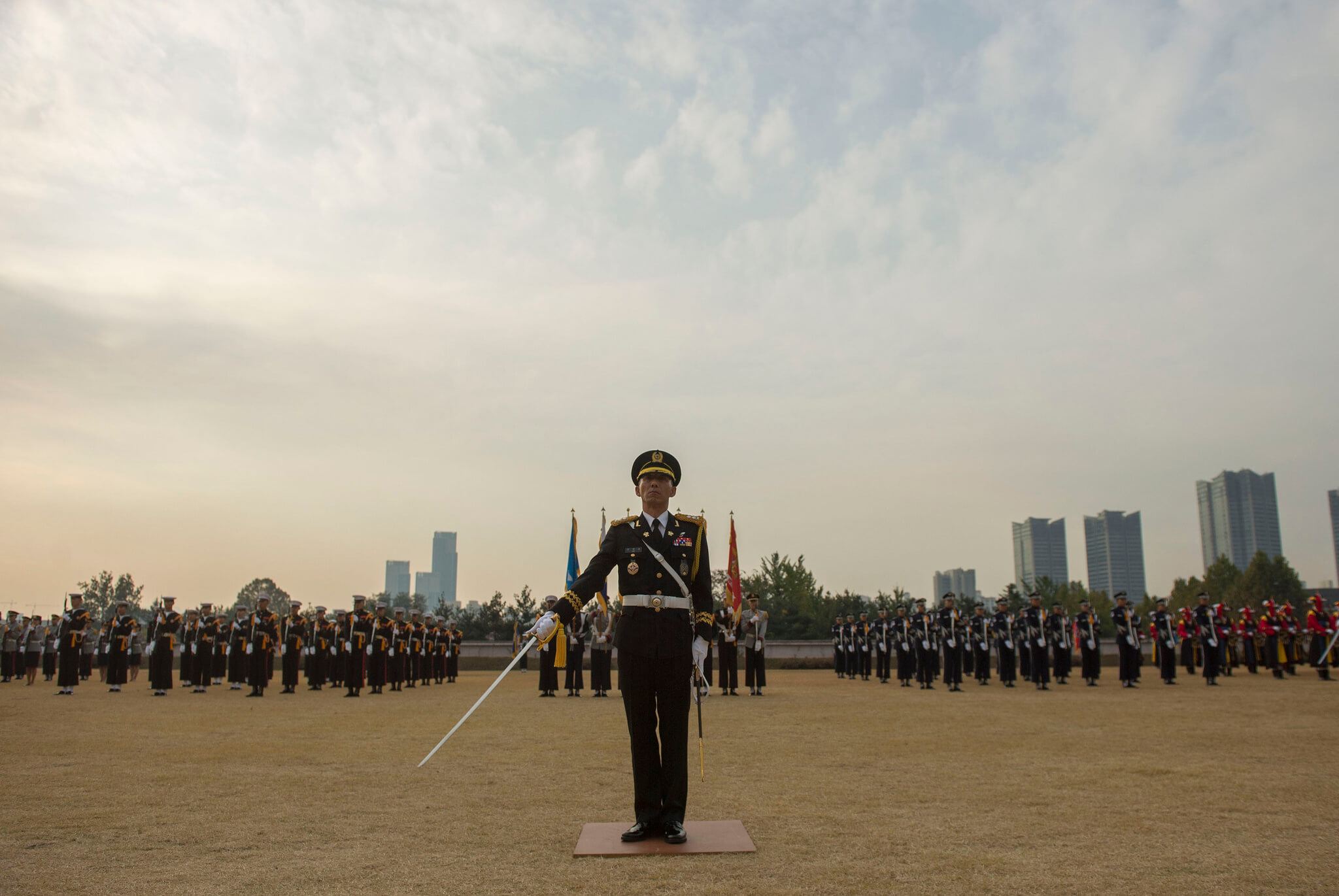 A mililtary demonstration in front of Seoul's skyline