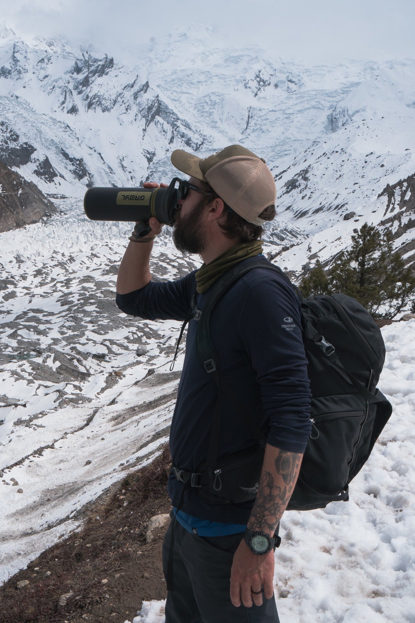 Man drinking from his grayl water filter bottle