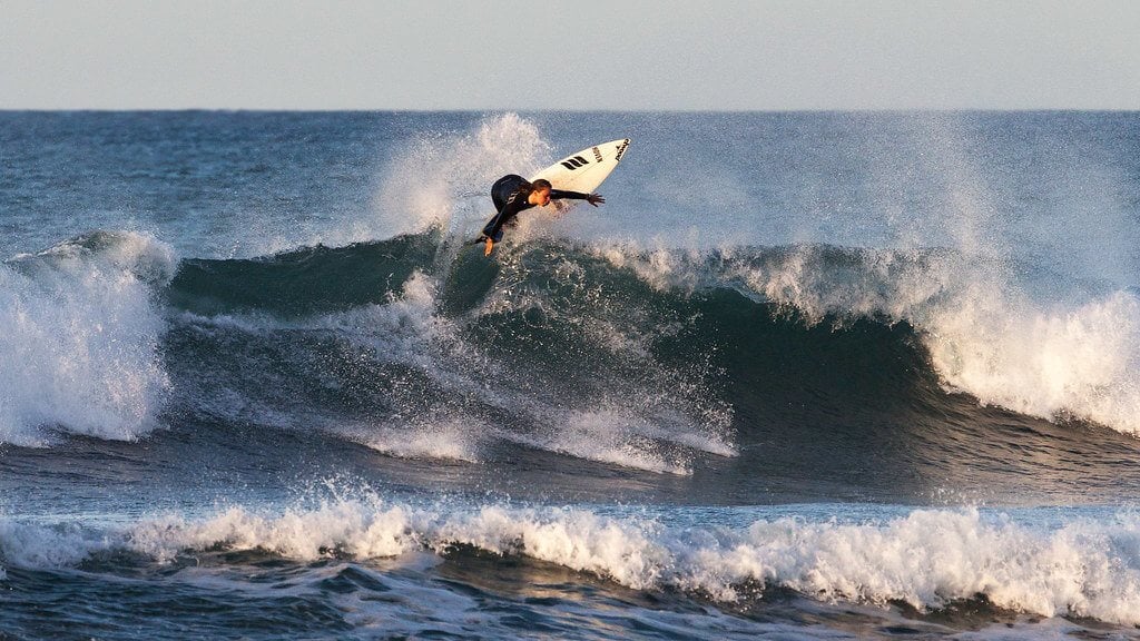 Badass chick surfing in Wellington