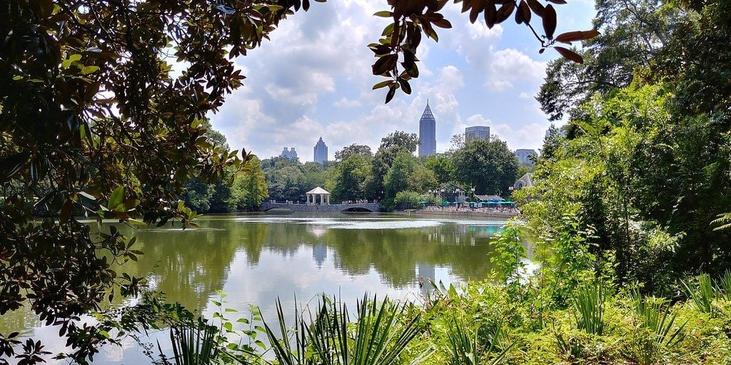 View over the water at Piedmont Park, Atlanta with city skyline in background