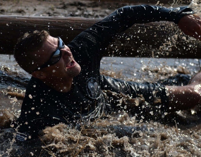 A man getting dirty on an extreme adventure trip