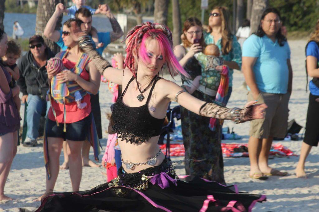 Alt girl having a solid doof boogie at a New Zealand festival