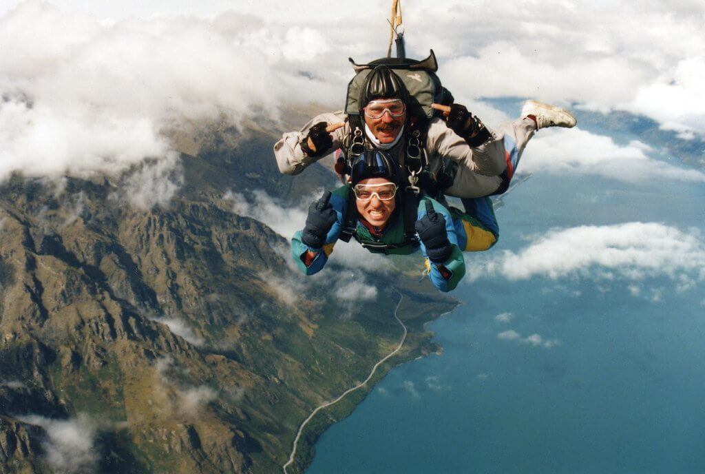 A man tandem skydiving in Queenstown over the Remarkables