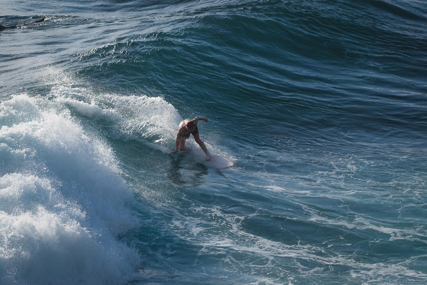 A person surfing a small wave 