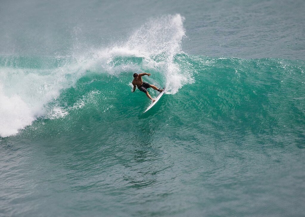 Man surfing at balangan uluwatu