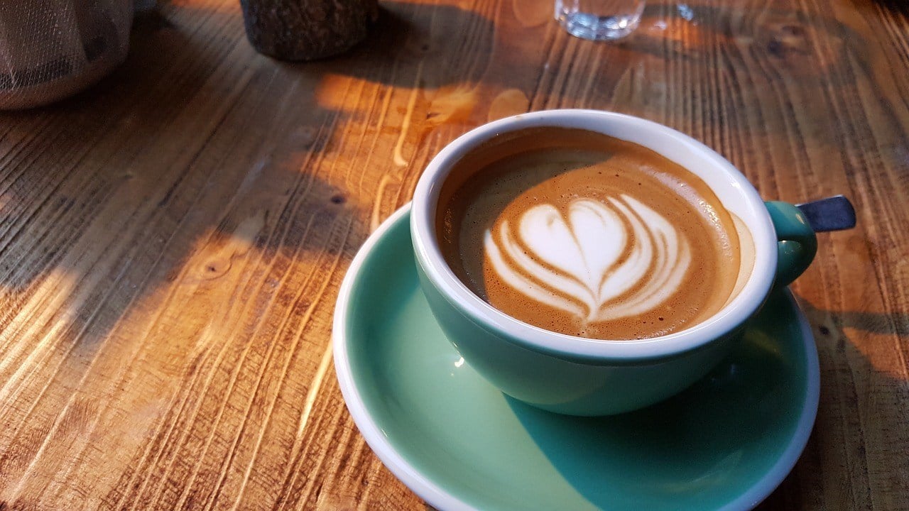 Espresso drink in teal cup and saucer at Suka Espresso