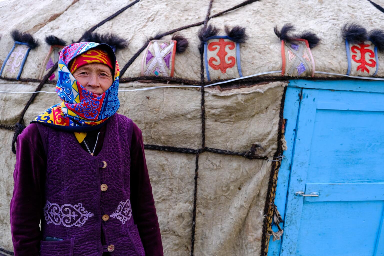 local women next to yurt in kyrgyzstan