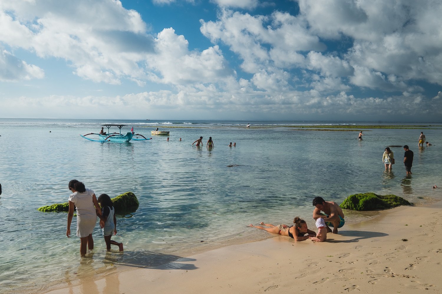 families playing at padang padang beach uluwatu