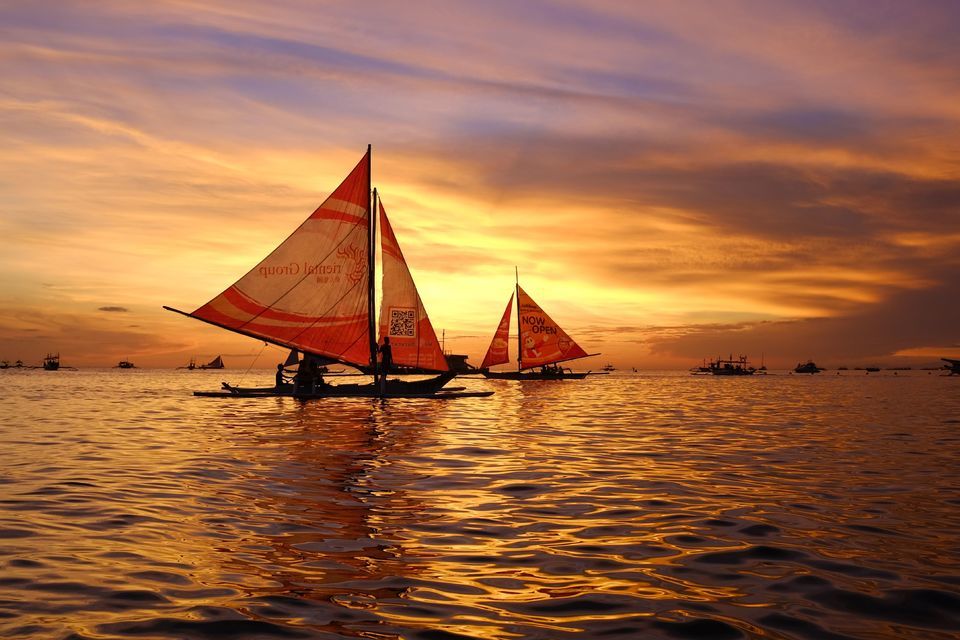 Sailboats at sunset. 