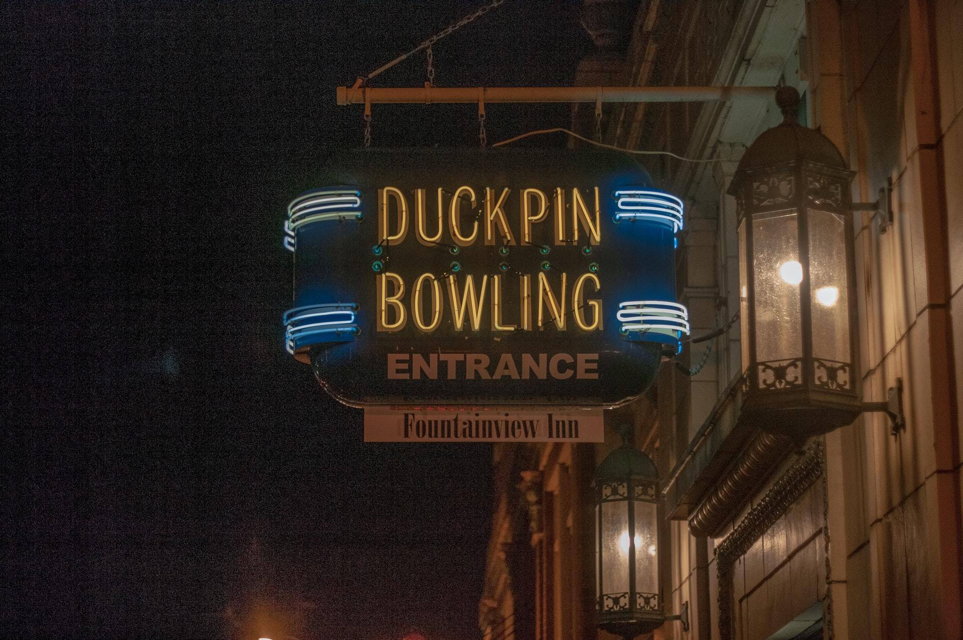 Neon entrance sign of Atomic Duckpin Bowling in Indianapolis