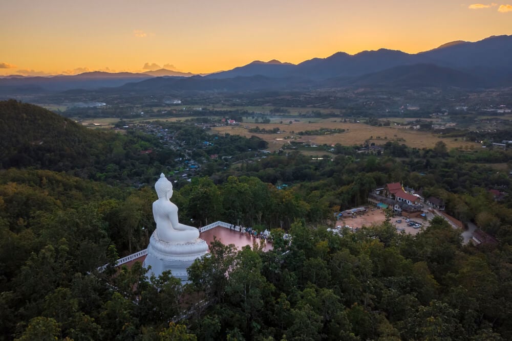 sunset at the white buddha pai thailand