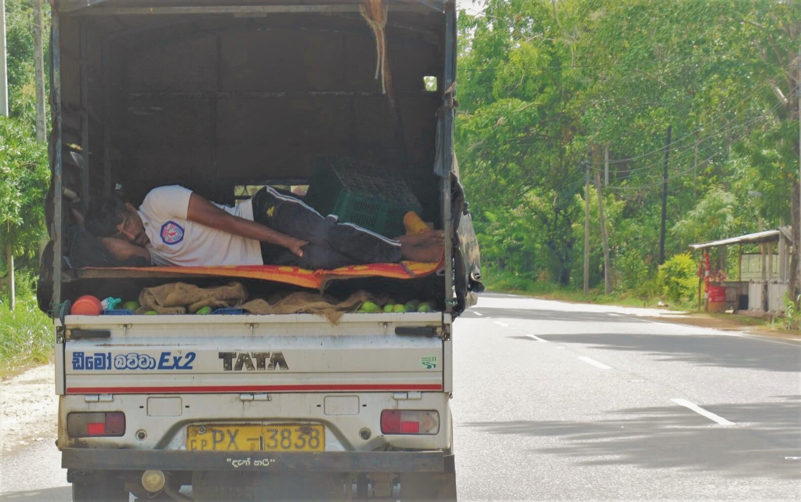 A man skips out on Sri Lanka's accommodation costs sleeping in a truck