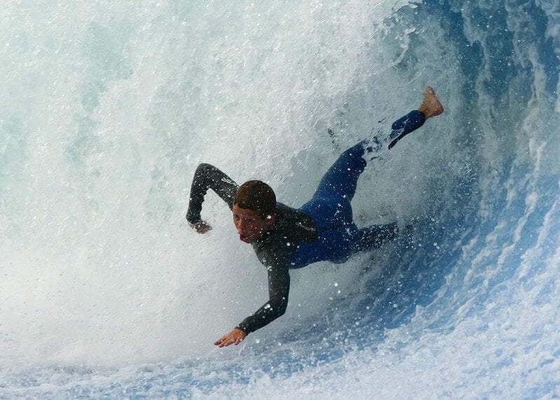 Guy surfing dangerous waves in Sri Lanka