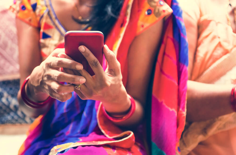 Woman using a SIM card in Sri Lanka