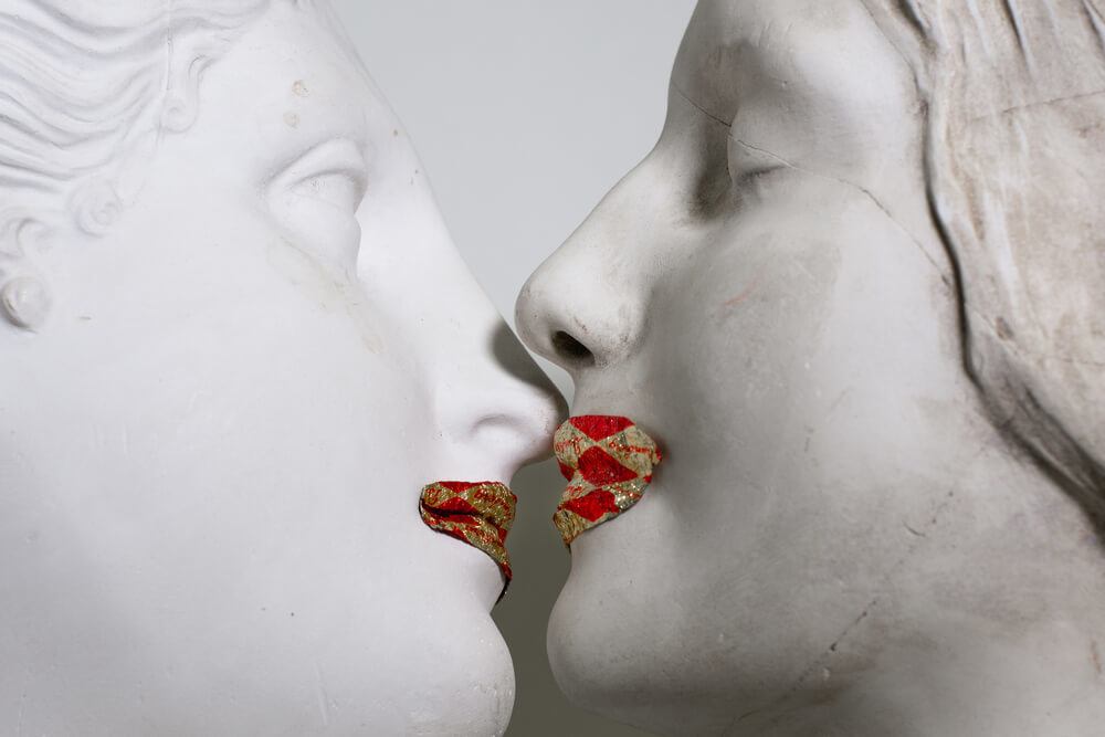 Ancient sculptures kissing