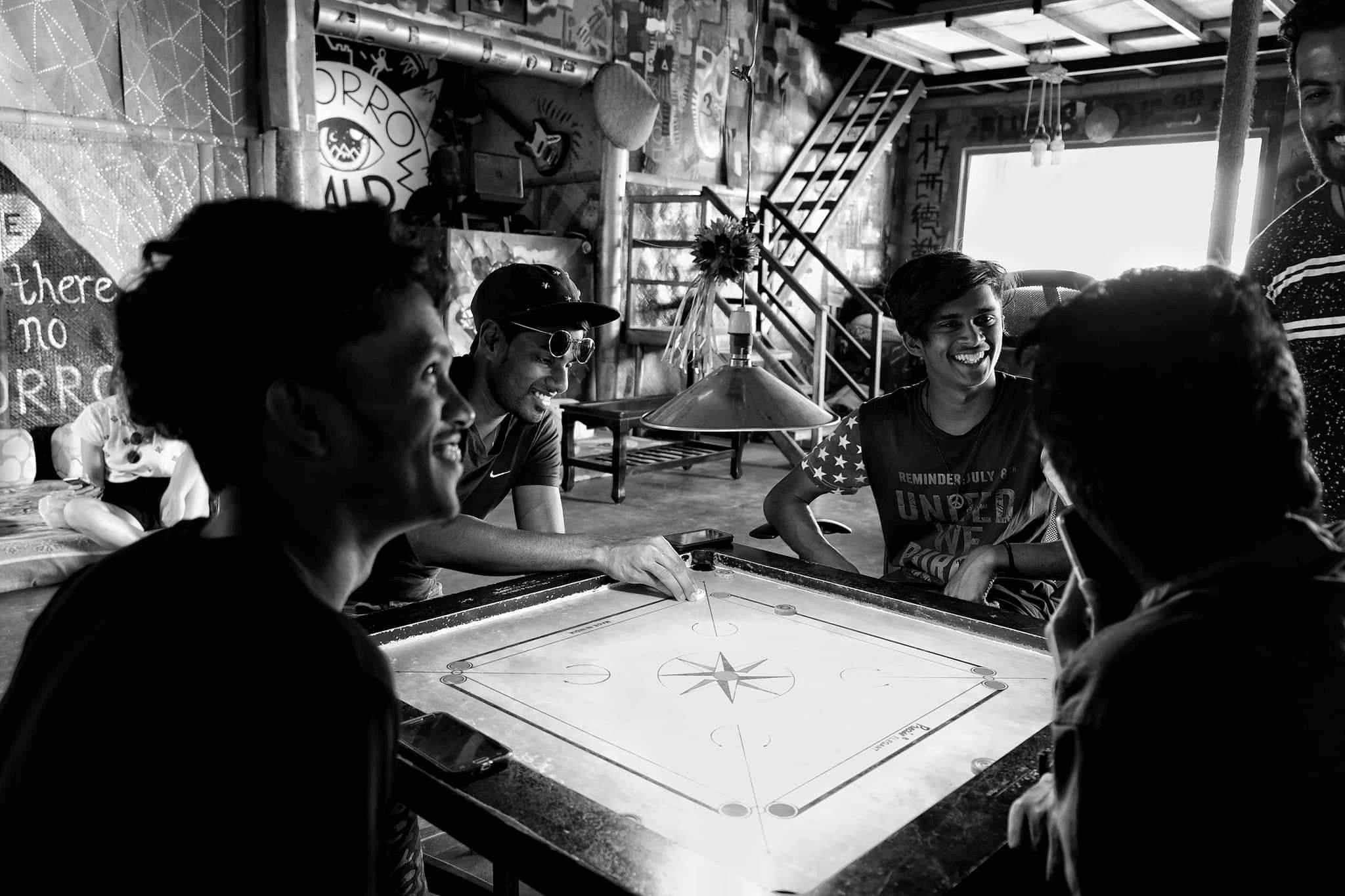 The boys playing Carom at Sri Lanka's best hostel