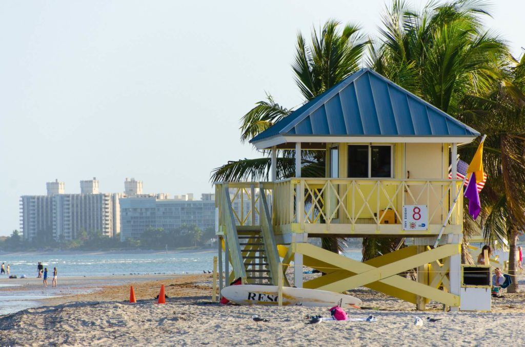 yellow lifeguard hut on beach miami travel guide