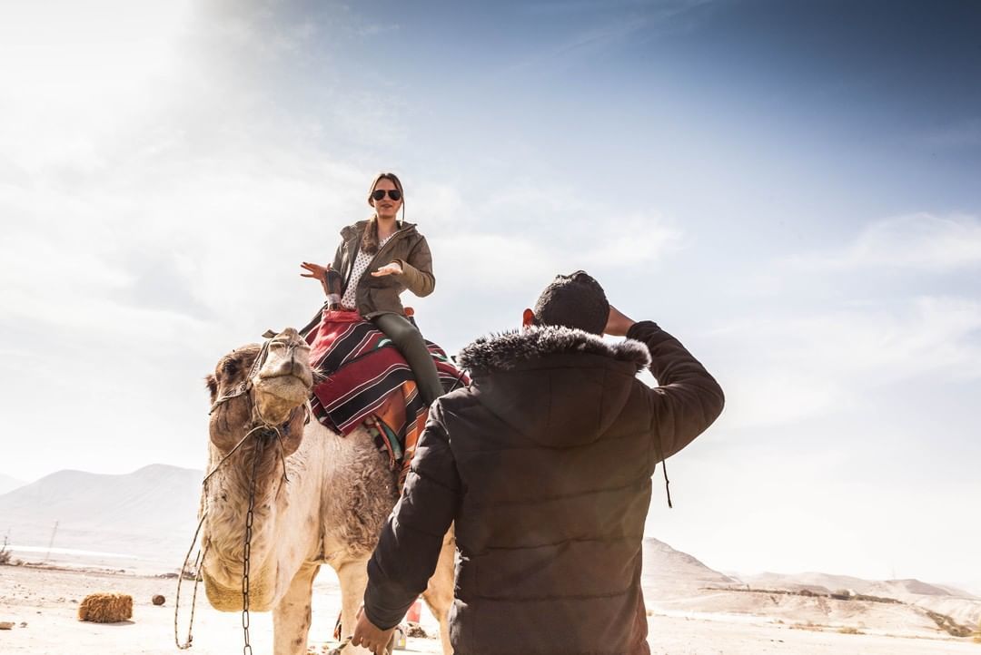 Woman on a camel with one of the best tour companies in Israel