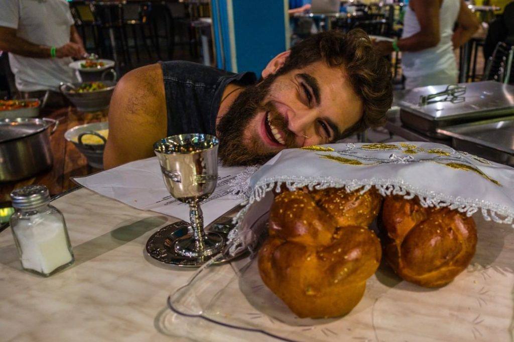 A very happy traveller smiling during passover at a famous hostel in Israel