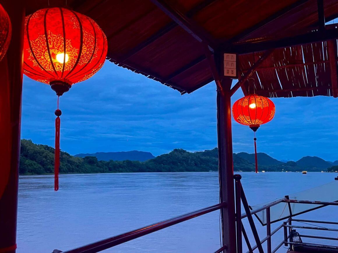 boat on the mekong river in the evening, vientiane