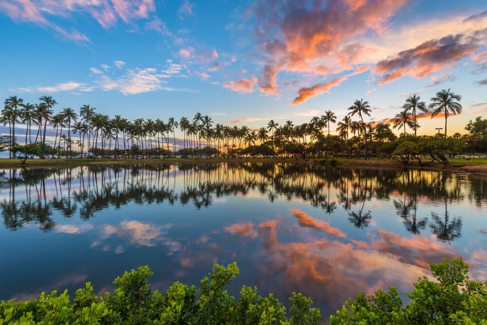 Evening sunset reflected on a water body at Ala Moana, one of the best places to stay in oahu