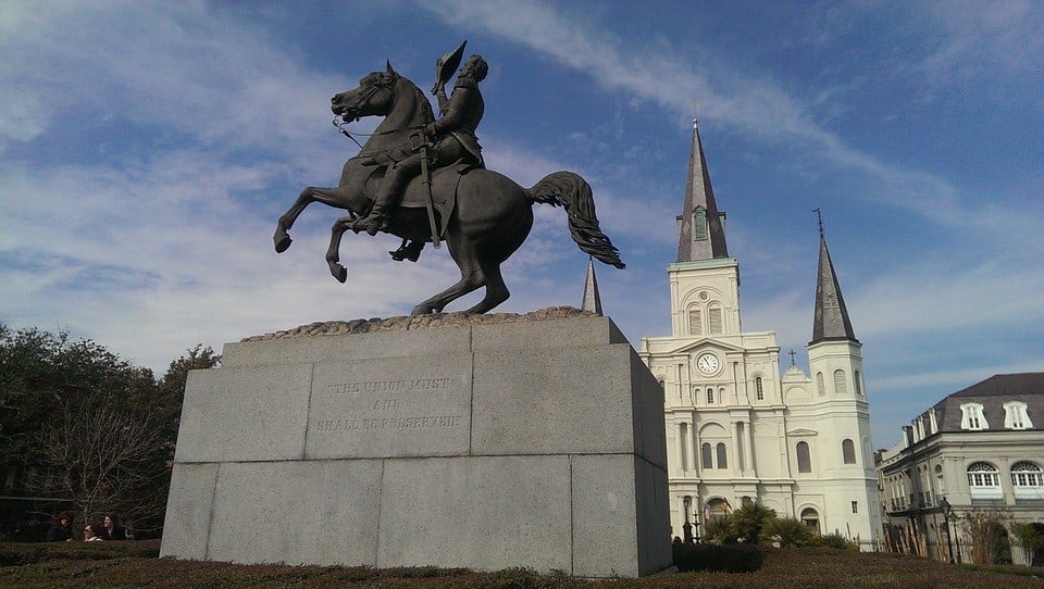 historical statue and church in new orleans