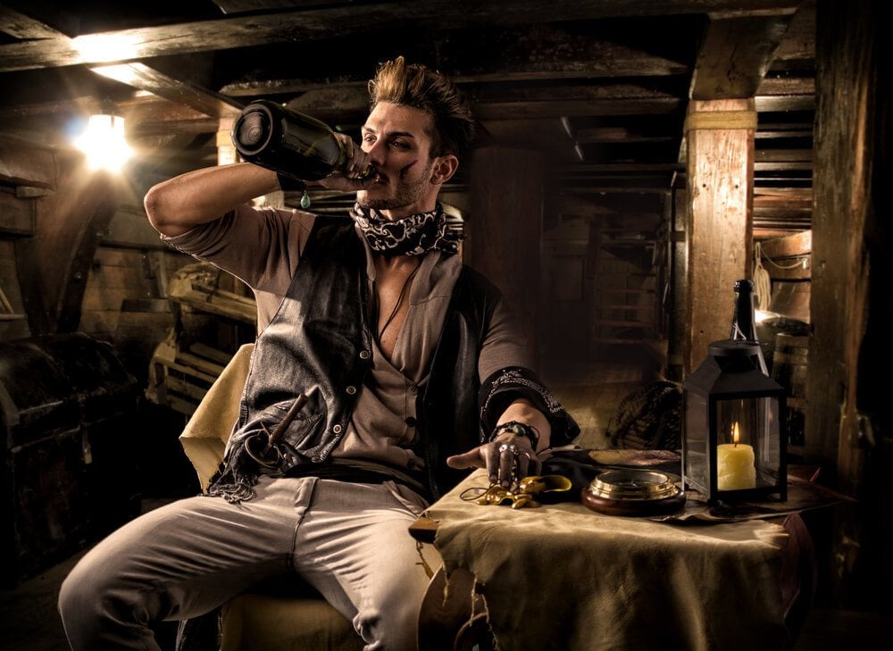 A pirate man drinking some Mauritian rum