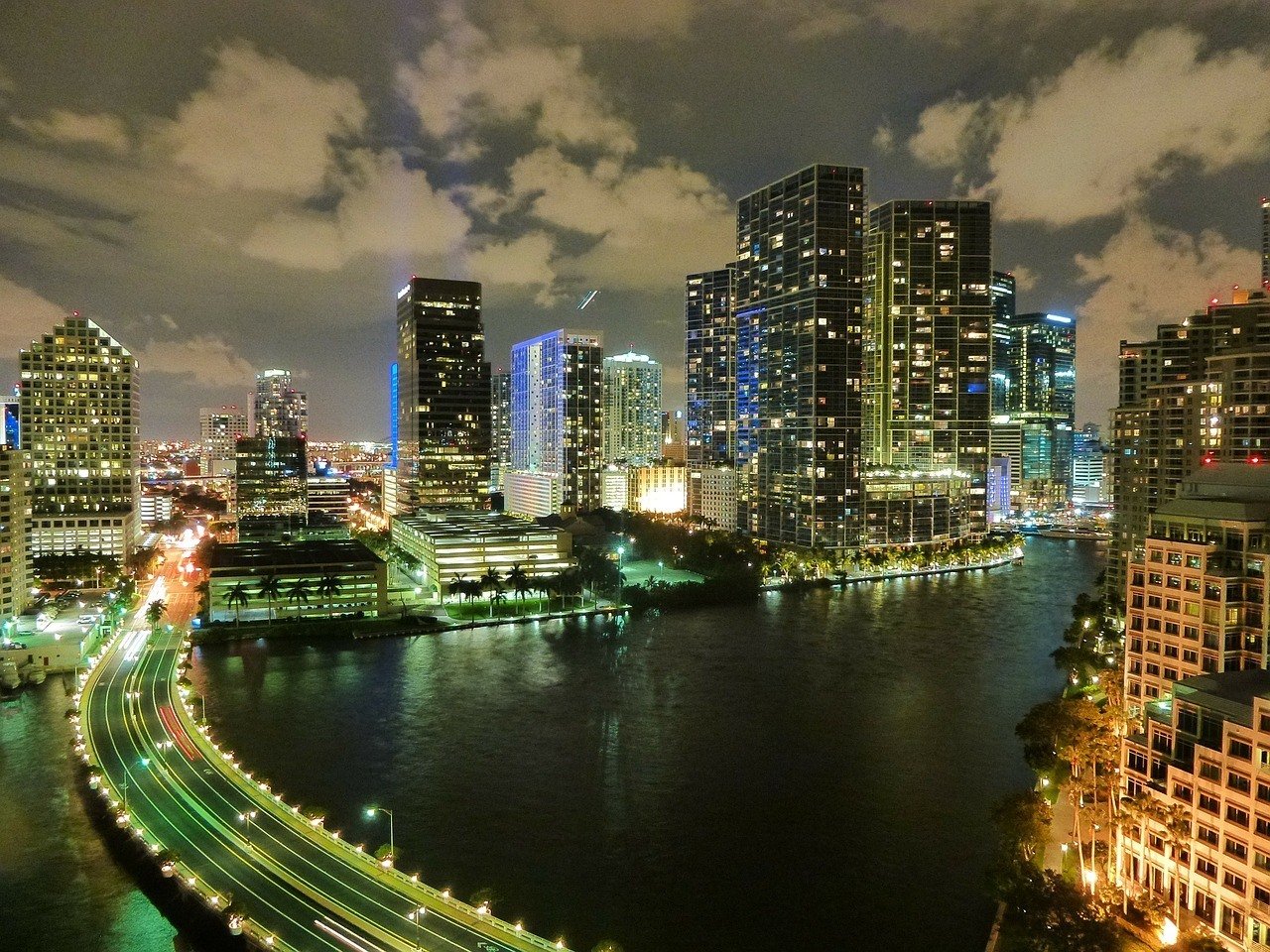 miami city at night lit up buildings