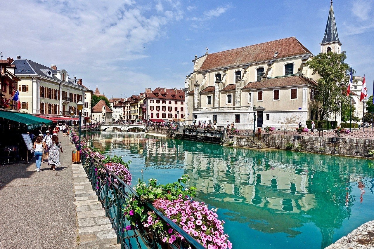 Bright blue canal waters in annecy, france, french alps