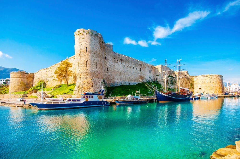 turquoise blue water in front of an old castle in Kyrenia, Cyprus
