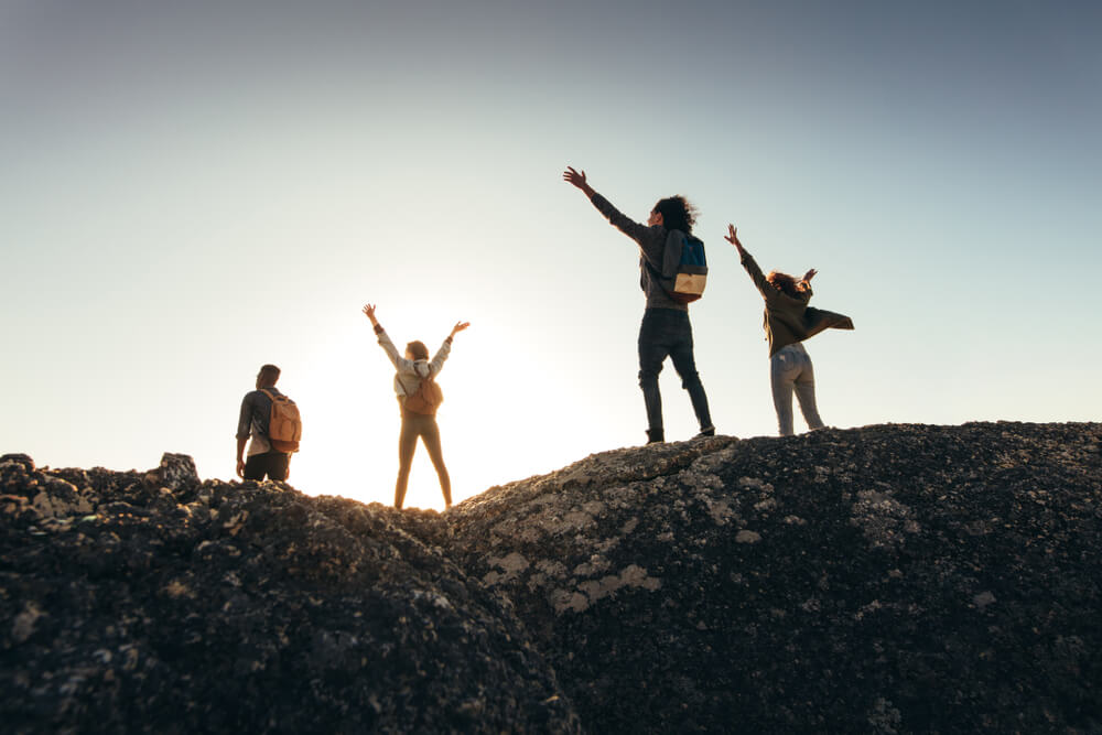 Group of travellers hiking who met at the best party hostel in the world